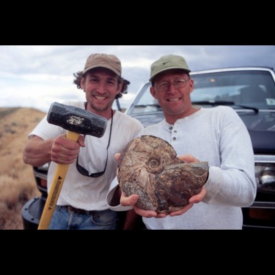 Gary Staab and his fossil hunting buddy Kent Hups show off their splendid ammonite find.