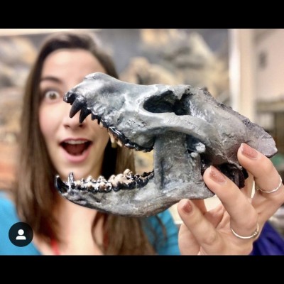 Amy and her favorite fossil, the bone-crushing Borophagine prehistoric dog called Paratomarctus.