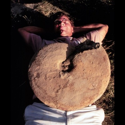 Kirk relaxing with a 30-pound ammonite on his belly at the Kremmling, Colorado dig site in 1998.