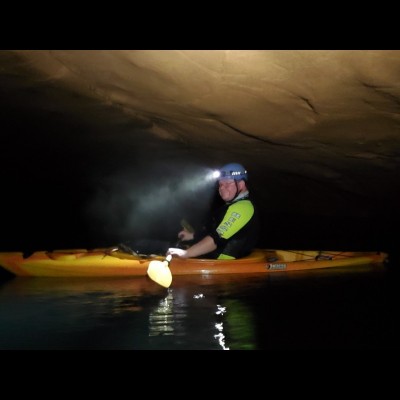 To get to some of the fossils at Mammoth Cave, a kayak is need to traverse underground waterways. Here is JP in his kayak in October 2020. (Photo by Rick Olsen/NPS).