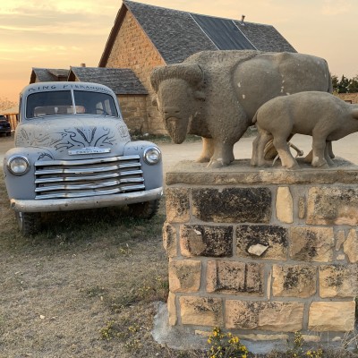 A limestone buffalo carving by Pete Felten greets visitors to the Keystone Gallery.