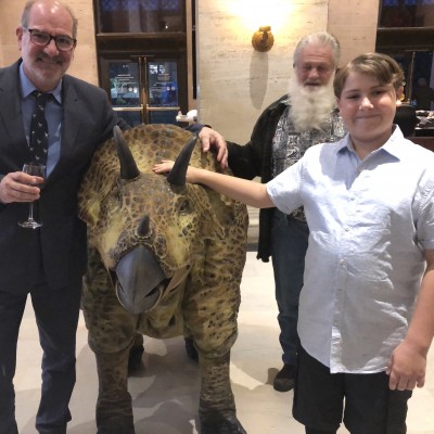 Luis and his son Luca hanging out with a Triceratops puppet at a party at the Natural History Museum of LA County. &nbsp;