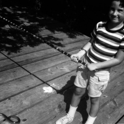 John as a kid with first fish (an eel!) caught in South Carolina.