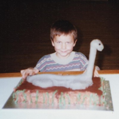 Young Dean with a paleo-themed cake!