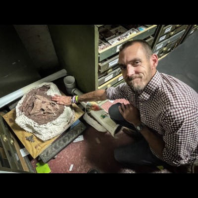 Chris Flis with a fine Eryops skull back in the collection room at the Whiteside Museum of Natural History.