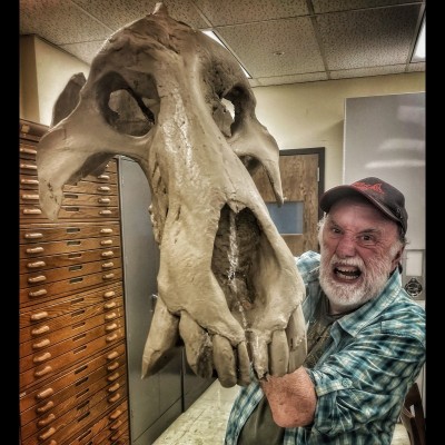 Ray mugging with a Dinohyus cast in the back rooms at Morrill Hall.&nbsp;