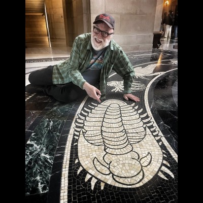 Ray Troll-o-bite gets down on the floor to ogle Hildreth's amazing mosaics in the Nebraska sate capitol building. For more about her work and this fantastic floor go to https://nebraskacapitolart.com/people/hildreth-meiere/